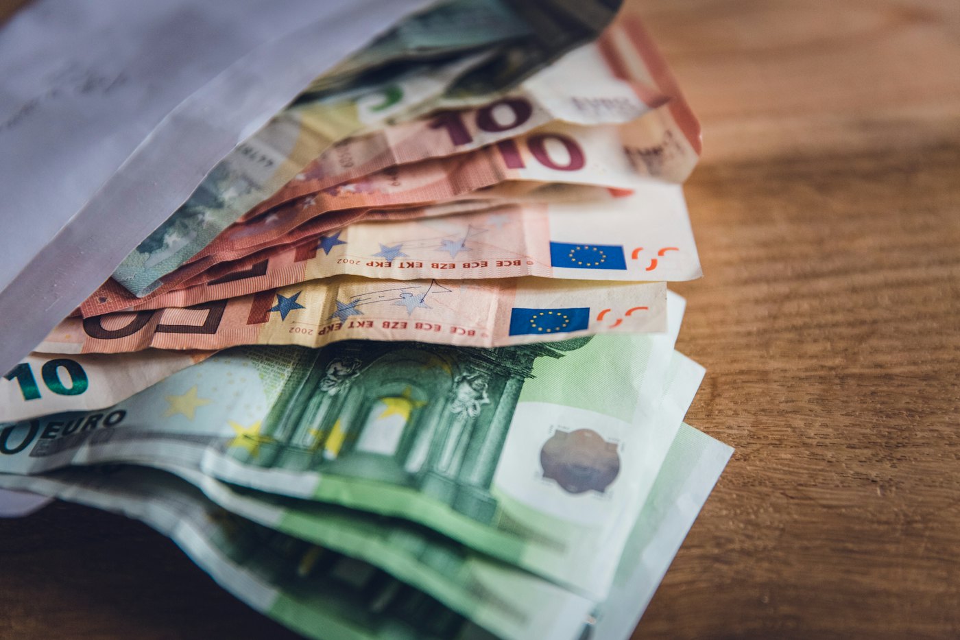 Euro banknotes in a paper envelope